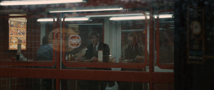 Fig. 10. Guillam and Smiley in a Wimpy bar. Some layered images, like the Wimpy Bar, as well as the grid-like archive in The Circus were constructed by computer graphics. For a discussion of the creation of these shots see “Digital Tinkering and Tailoring by Framestore” and Vincent Frei’s interview “Tinker Taylor Soldier Spy: Sirio Quintavalle—VFX Supervisor—Framestore.”.