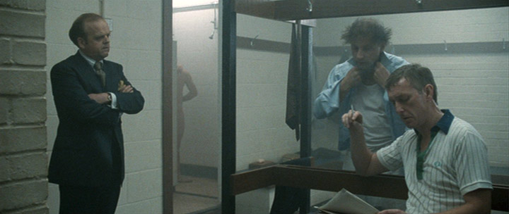 Fig. 13. Percy Alleline meets with government officials in a locker room.