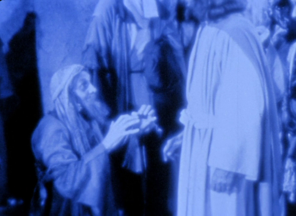 Fig. 13. Den kurerede tigger går ned på knæ for Jesus.