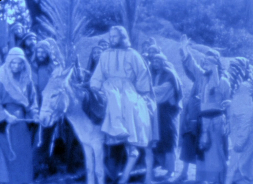 Fig. 18. Jesus hopper op på et æsel.