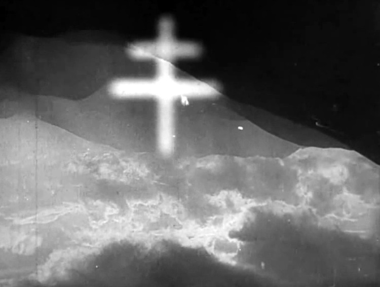 Fig. 6: The montage that follows as Jánošík hangs dying is of the Tatra mountains, culminating with the double-barred cross found in the Slovak coat of arms.