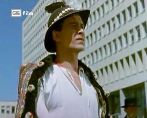 Fig. 9: Native Land (dir. Josef Mach, 1954). Martin Ťapák (here in the role of Martin) made a name for himself as a director of comedic Slovak folk-operas in the 1970s, but before then, he was a dancer and singer in various Socialist Realist folk productions, like Native Land. Note the contrast between modern Bratislava and Martin’s traditional garments.